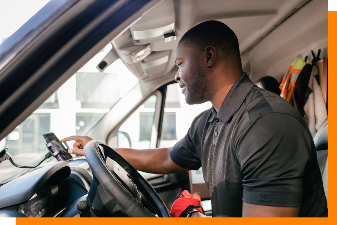 Driver looking at app Driver looking at app
